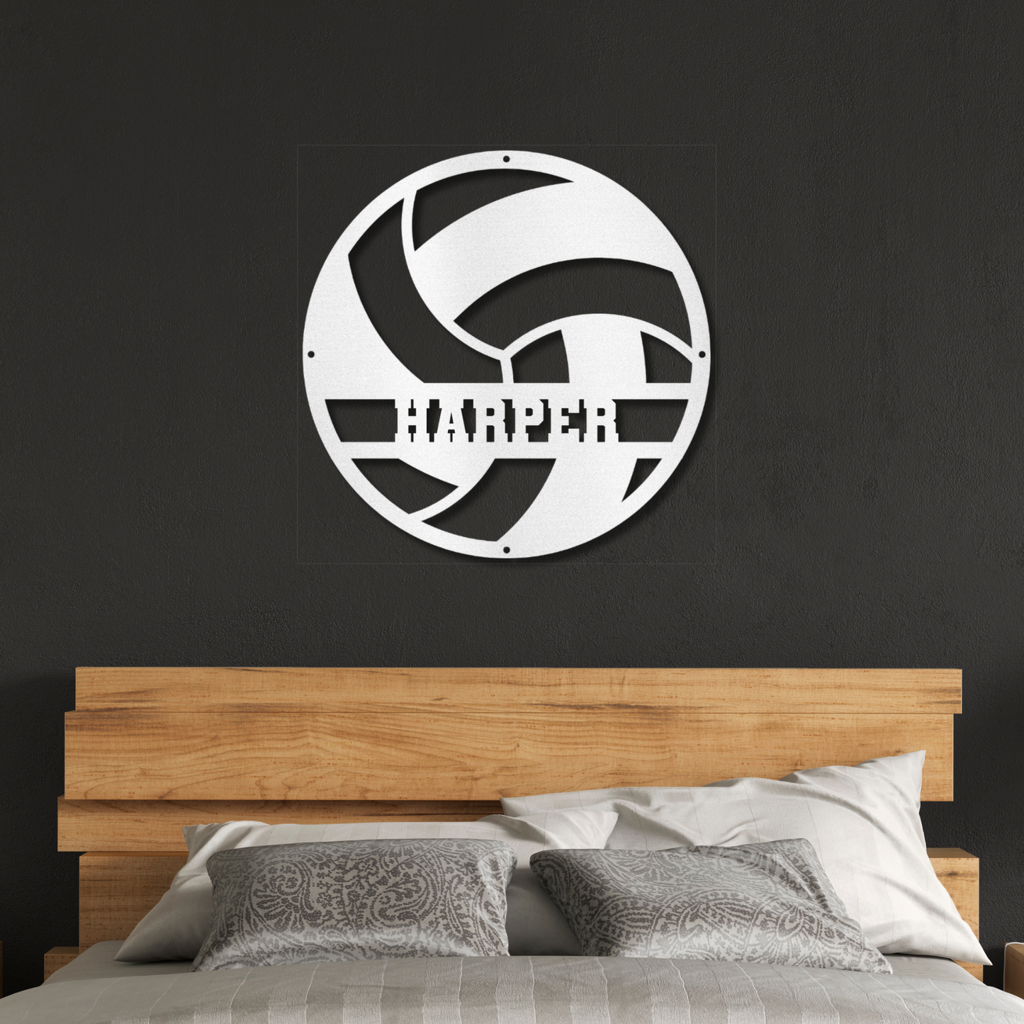 Bedroom with wooden headboard and decorative wall art on a black wall